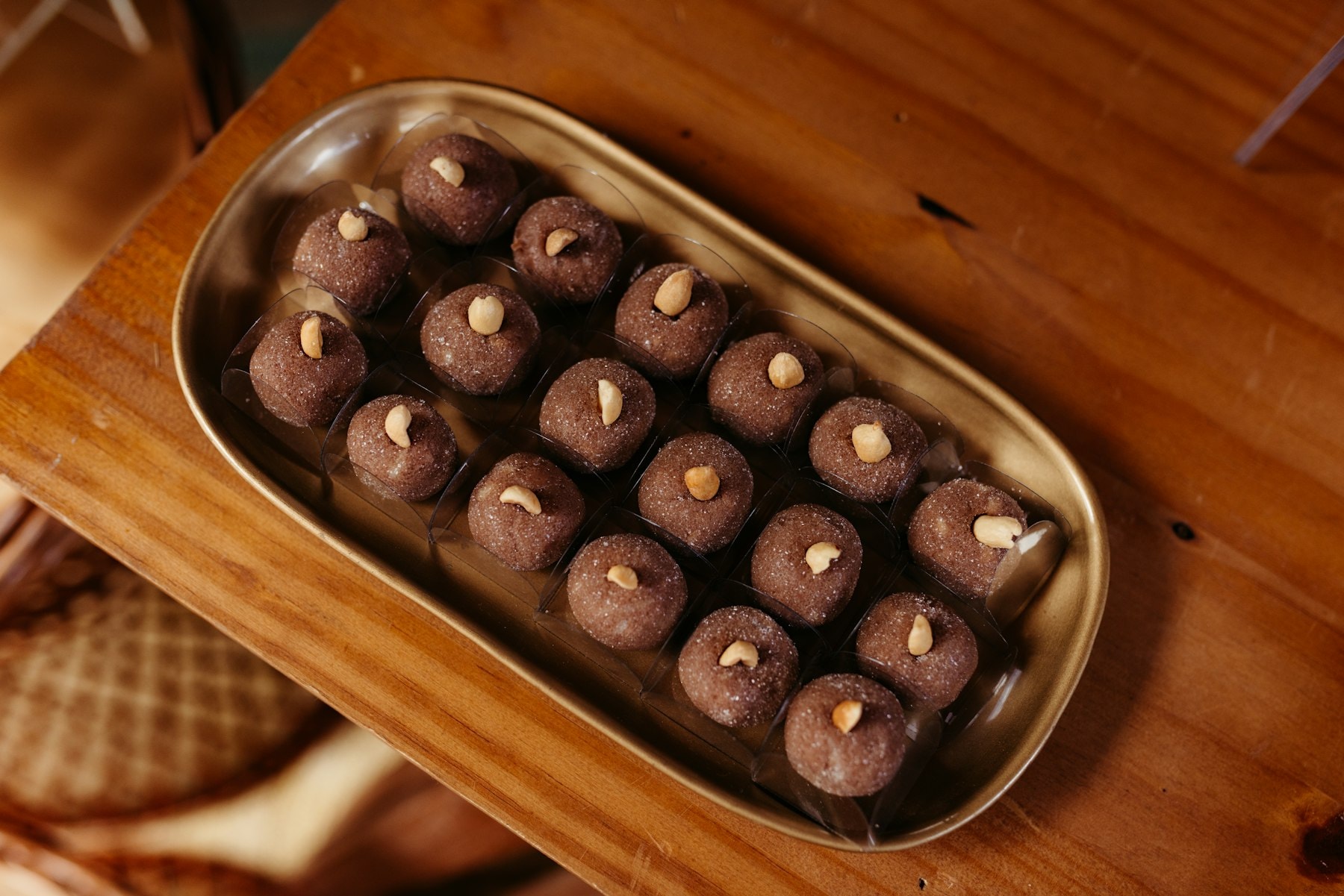 Tray of chocolate candies topped with nuts — limited edition box